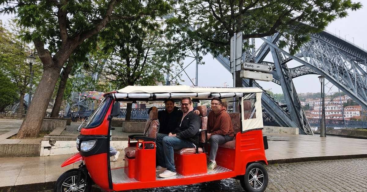 Electric tuk-tuk by the Douro river on the Porto food tour