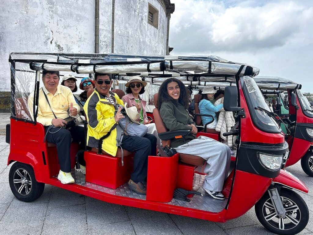 Group of guests on a tuk tuk tour at the Serra do Pilar monastery