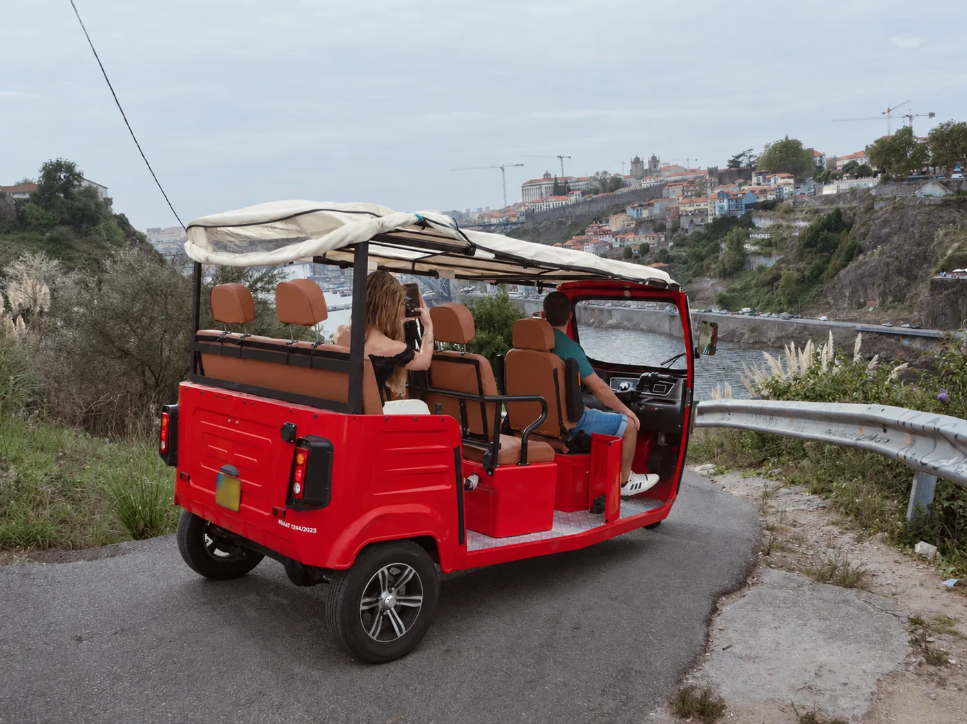 Private red tuk-tuk tour beside the Douro River in Porto
