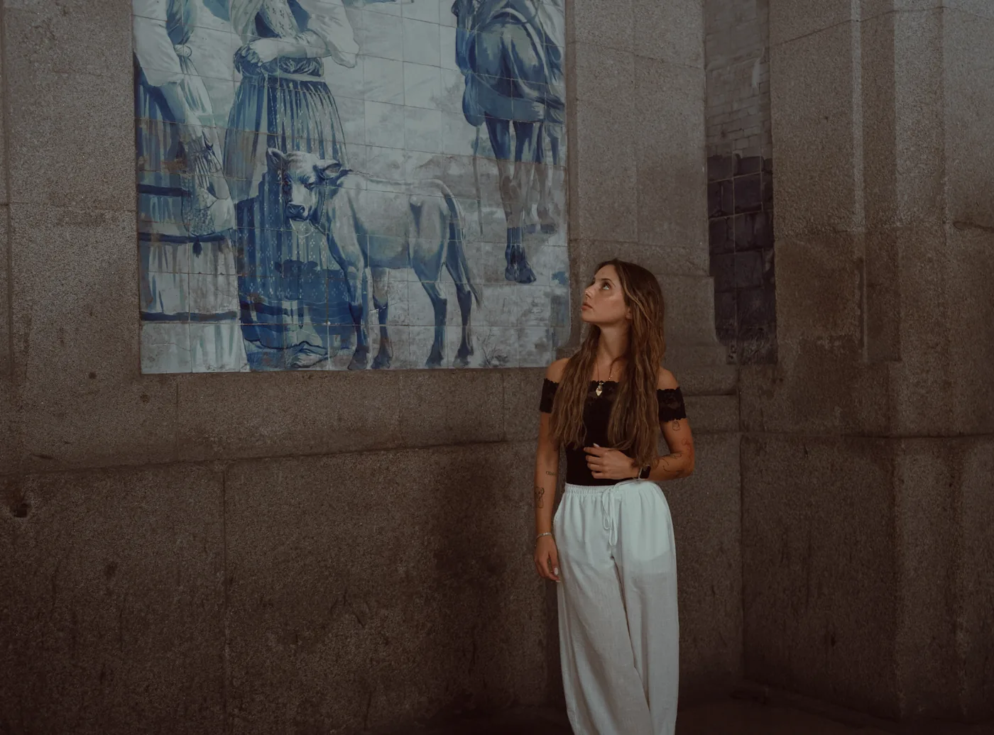 Admiring the blue-and-white azulejos at São Bento station in Porto